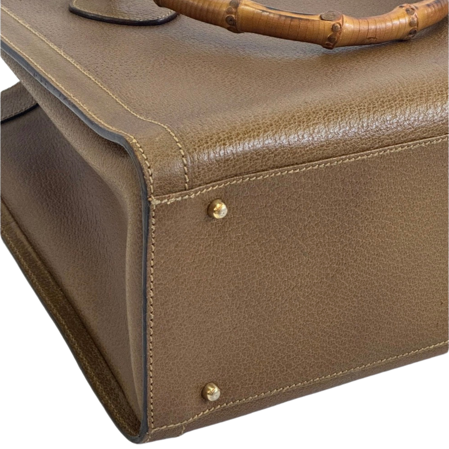 Close-up of a leather bag with gold hardware o