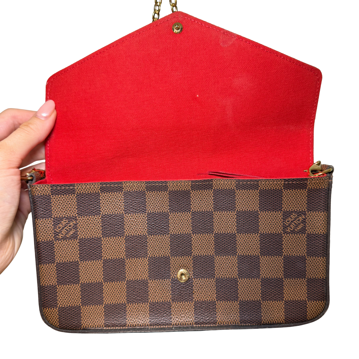 Red interior of a Louis Vuitton Pochette Félicie