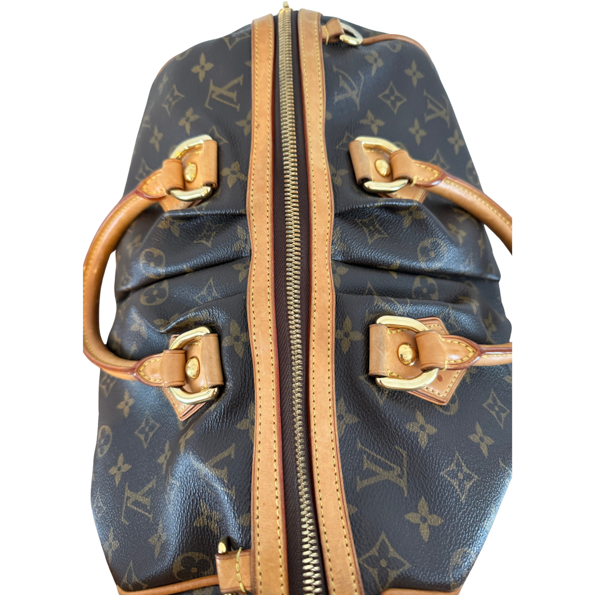 Designer Louis Vuitton handbag with monogram pattern and gold hardware 