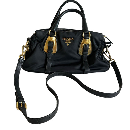 Front view of Black Prada handbag with gold hardware  