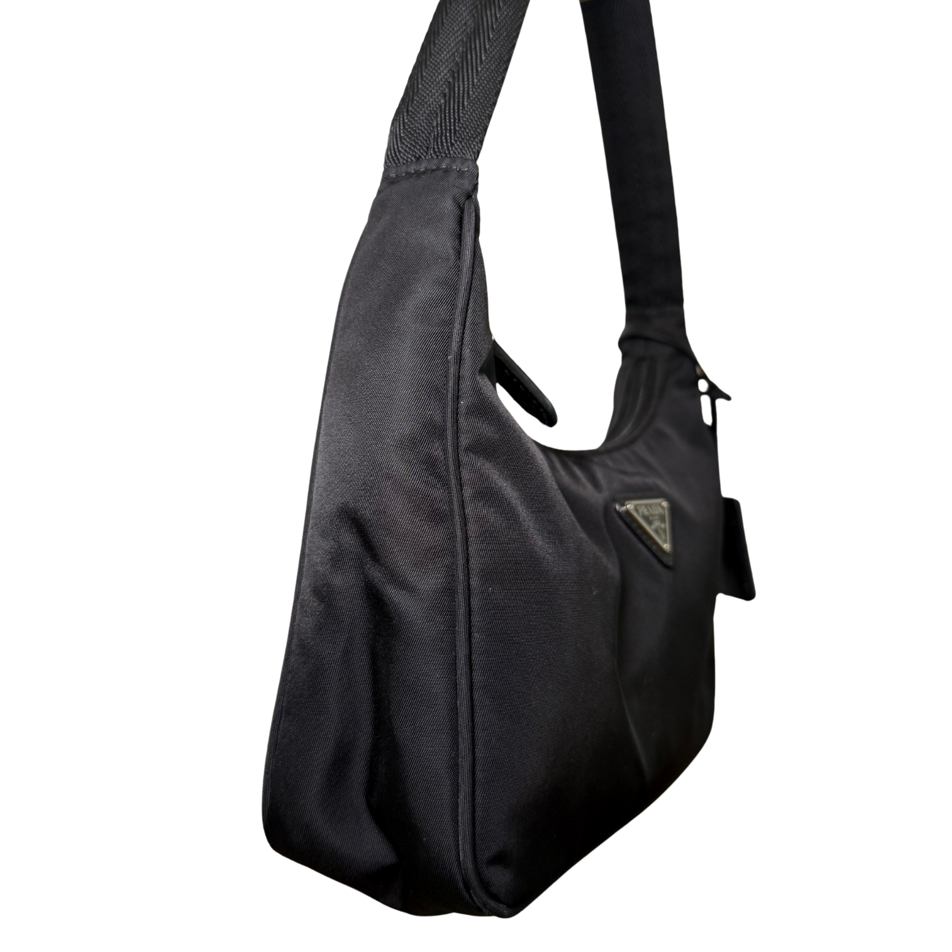 Side view of Prada Re-Nylon Re-Edition 2000 Bag in excellent condition