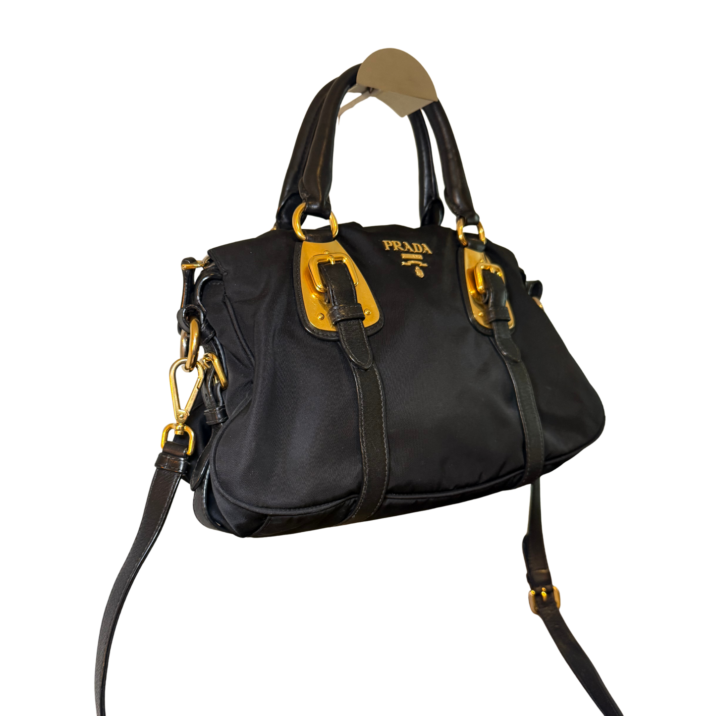 Black handbag with gold accents and Prada logo with buckle details