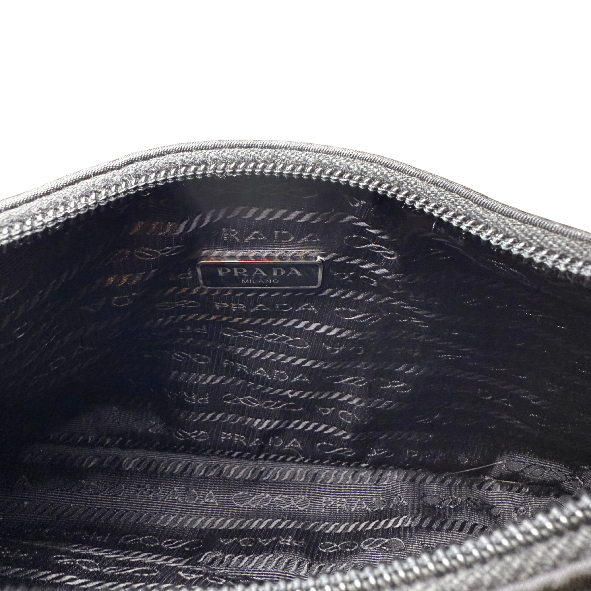 interior view of Prada Re-Nylon Re-Edition 2000 Bag showing lining and zip.