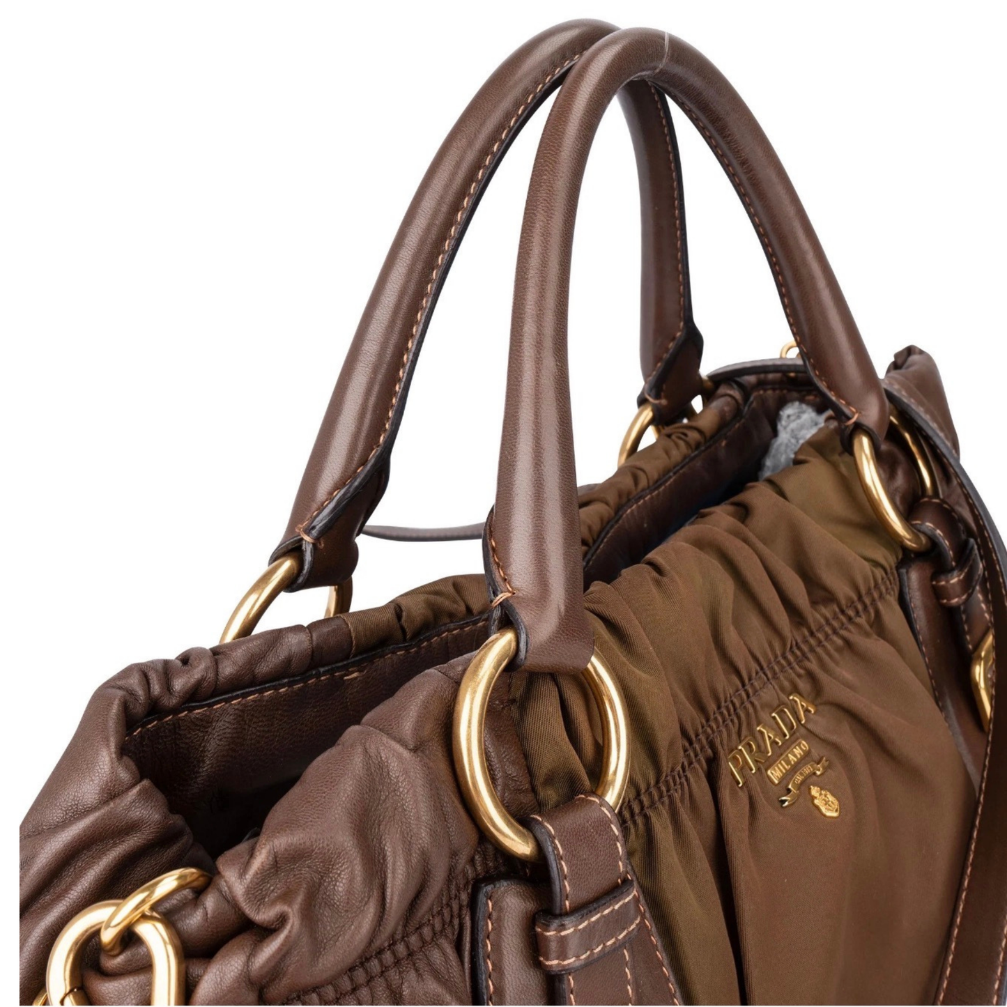 close up details of Prada handles with gold hardware